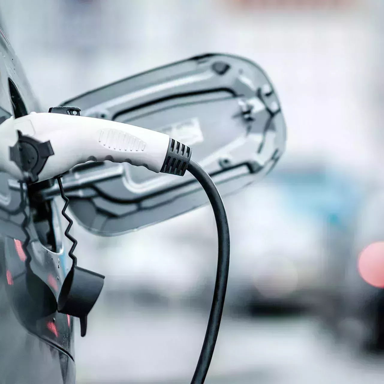 Open charging flap of electric car with charging lid