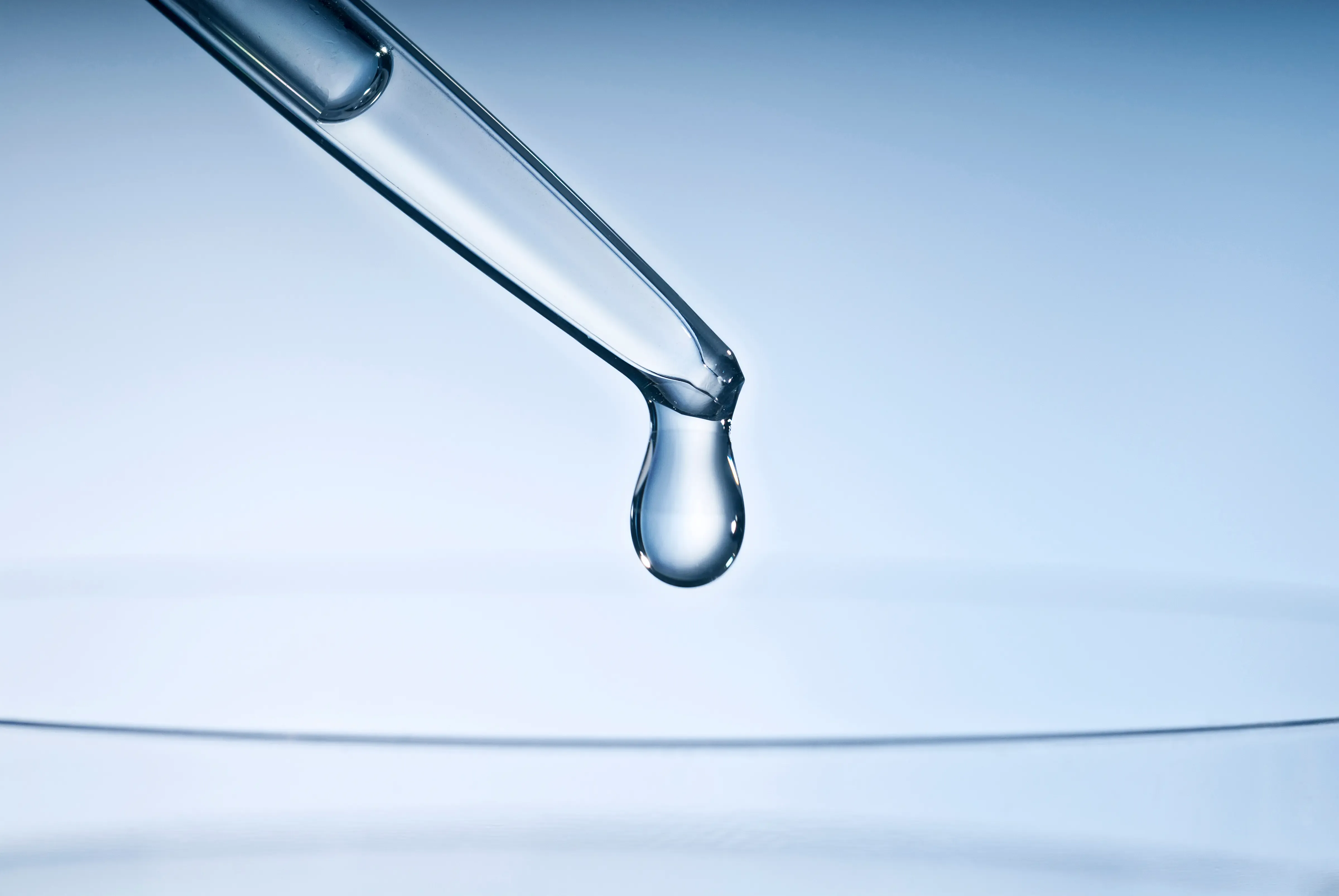 A drop falling from a pipette