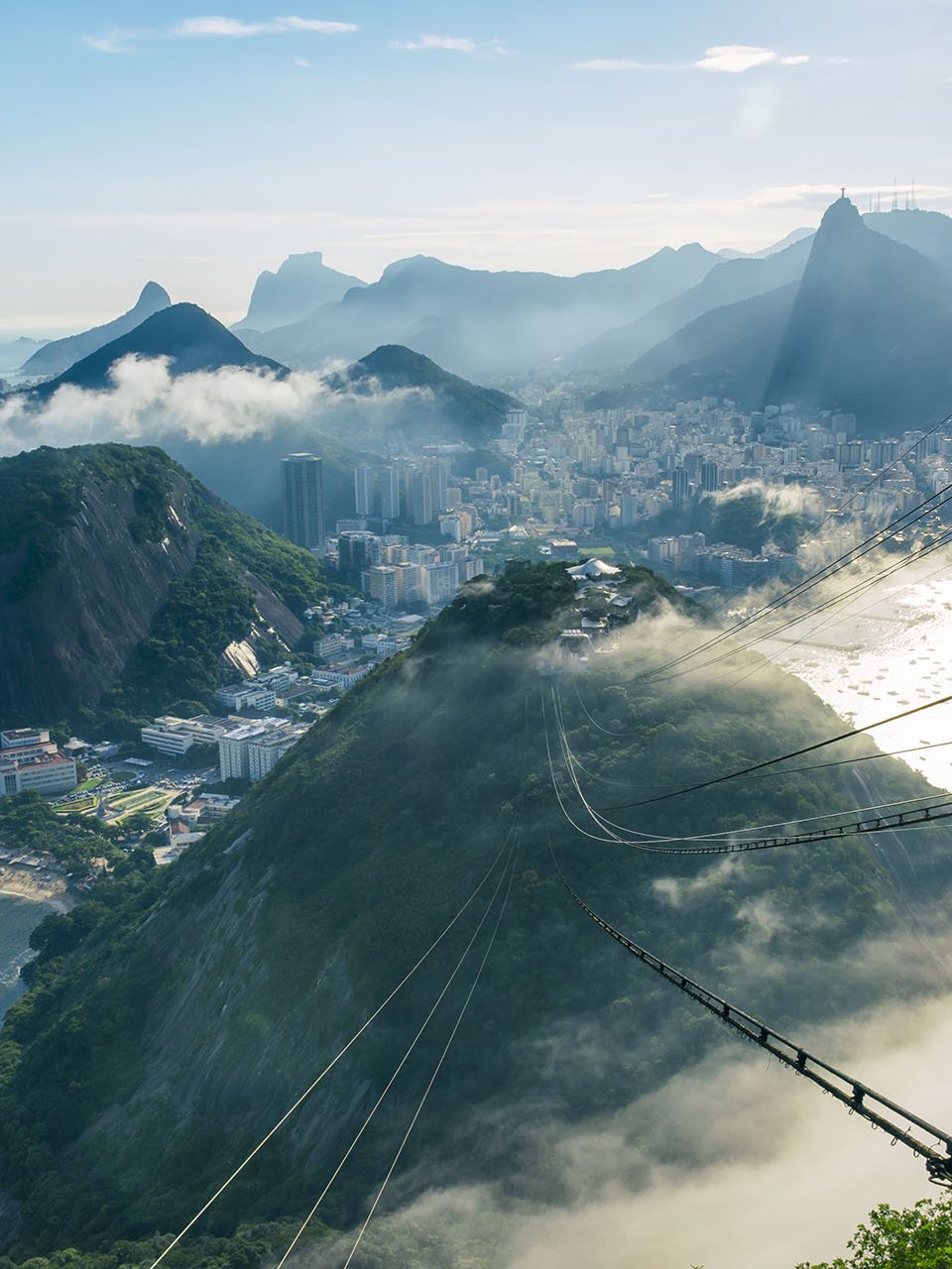Cable car over mountains and a city